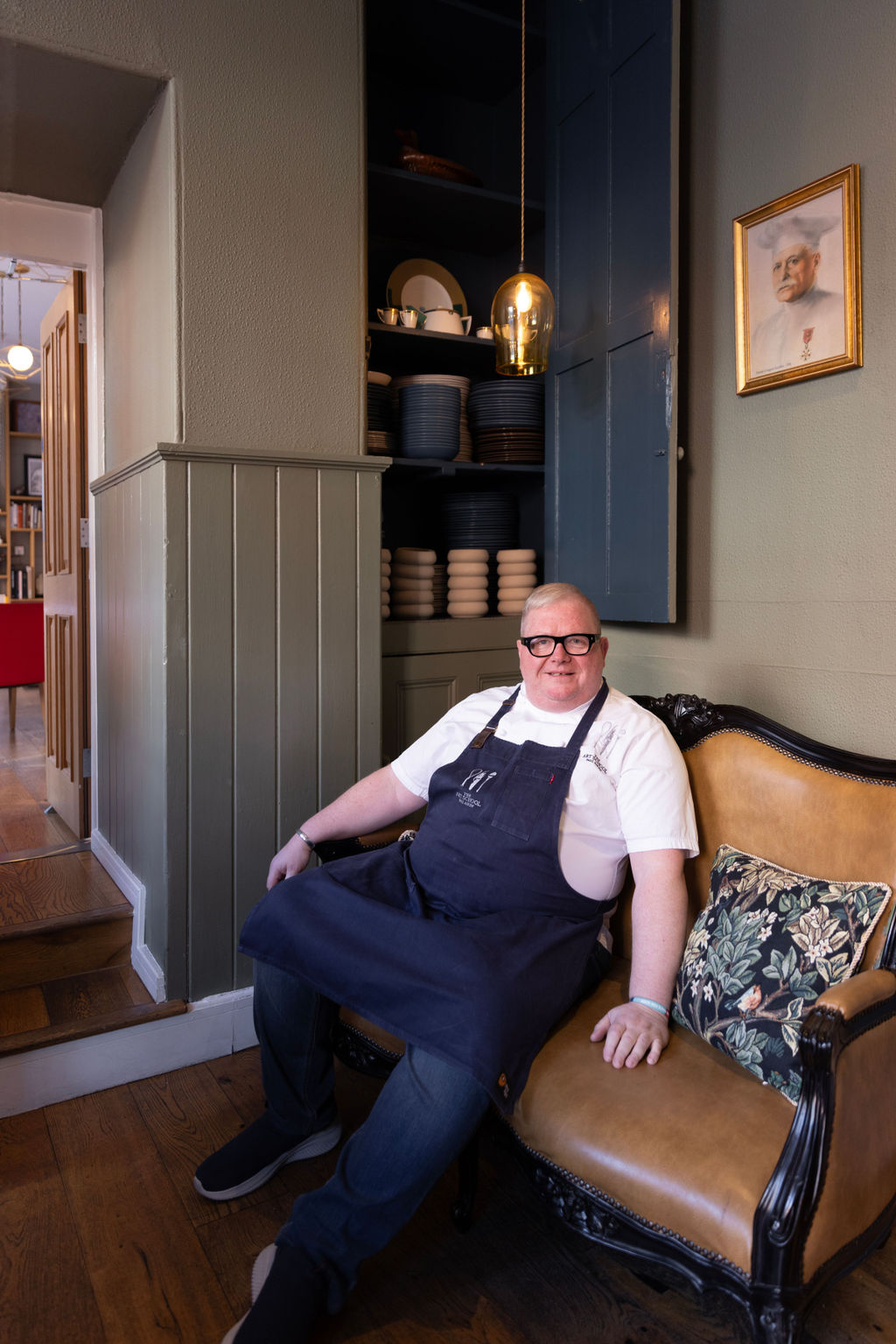 Chef owner Paul Askew sat in his restaurant The Art School Liverpool image shot for The Caterer Magazine